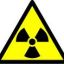 ธาตุกัมมันตรังสี (อังกฤษ: radioactive element) คือธาตุพลังงานสูงกลุ่มหนึ่งที่สามารถแผ่รังสี แล้วกลายเป็นอะตอมของธาตุใหม่ได้ มีประวัติการค้นพบดังนี้

   1. รังสีเอกซ์ ถูกค้นพบโดย Conrad Röntgen อย่างบังเอิญเมื่อปี ค.ศ. 1895
   2. ยูเรเนียม ค้นพบโดย Becquerel เมื่อปี ค.ศ. 1896 โดยเมื่อเก็บยูเรเนียมไว้กับฟิล์มถ่ายรูป ในที่มิดชิด ฟิล์มจะมีลักษณะ เหมือนถูกแสง จึงสรุปได้ว่าน่าจะมีการแผ่รังสีออกมาจากธาตุยูเรเนียม เขาจึงตั้งชื่อว่า Becquerel Radiation
   3. พอโลเนียม ถูกค้นพบและตั้งชื่อโดย มารี กูรี ตามชื่อบ้านเกิด (โปแลนด์) เมื่อปี ค.ศ. 1898 หลังจากการสกัดเอายูเรเนียมออกจาก Pitchblende หมดแล้ว แต่ยังมีการแผ่รังสีอยู่ สรุปได้ว่ามีธาตุอื่นที่แผ่รังสีได้อีกแฝงอยู่ใน Pitchblende นอกจากนี้ กูรียังได้ตั้งชื่อเรียกธาตุที่แผ่รังสีได้ว่า ธาตุกัมมันตรังสี และเรียกรังสีนี้ว่า กัมมันตภาพรังสี
   4. เรเดียม ถูกตั้งชื่อไว้เมื่อปี ค.ศ. 1898 หลังจากสกัดเอาพอโลเนียมออกจากพิตช์เบลนด์หมดแล้ว พบว่ายังคงมีการแผ่รังสี จึงสรุปว่ามีธาตุอื่นที่แผ่รังสีได้อีกใน Pitchblende ในที่สุดกูรีก็สามารถสกัดเรเดียมออกมาได้จริง ๆ จำนวน 0.1 กรัม ในปี ค.ศ. 1902

ด้วยเหตุนี้นี่เอง ทำให้ผู้ค้นพบได้รับรางวัลต่าง ๆ ดังนี้

    * Conrad Röntgen ได้รับรางวัลโนเบลสาขาฟิสิกส์ ปี ค.ศ. 1901
    * Pierre, Marie Curie ได้รับรางวัลเหรียญเดวี่จากราชบัณฑิตยสภาแห่งสหราชอาณาจักร ปี ค.ศ. 1903
    * Pierre, Marie Curie และ Henri Becquerel ได้รับรางวัลโนเบลสาขาฟิสิกส์ ปี ค.ศ. 1903
    * Mme Curie ได้รับรางวัลโนเบลสาขาเคมี ปี ค.ศ. 1911

ส่วนรังสีที่แผ่ออกมาจากธาตุนั้น แบ่งเป็น 3 ชนิดคือ

   1. รังสีแอลฟา (สัญลักษณ์: α) คุณสมบัติ เป็นนิวเคลียสของอะตอมฮีเลียม (4 2He) มี p+ และ n อย่างละ 2 อนุภาค ประจุ +2 เลขมวล 4 อำนาจทะลุทะลวงต่ำ เบี่ยงเบนในสนามไฟฟ้าเข้าหาขั้วลบ
   2. รังสีบีตา (สัญลักษณ์: β) คุณสมบัติ เหมือน e- อำนาจทะลุทะลวงสูงกว่า α 100 เท่า ความเร็วใกล้เสียง เบี่ยงเบนในสนามไฟฟ้าเข้าหาขั้วบวก
   3. รังสีแกมมา (สัญลักษณ์: γ) คุณสมบัติเป็นคลื่นแม่เหล็กไฟฟ้า (Electromagnetic Wave) ที่มีความยาวคลื่นสั้นมากไม่มีประจุและไม่มีมวล อำนาจทะลุทะลวงสูงมาก ไม่เบี่ยงเบนในสนามไฟฟ้า เกิดจากการที่ธาตุแผ่รังสีแอลฟาและแกมมาแล้วยังไม่เสถียร มีพลังงานสูง จึงแผ่เป็นคลื่นแม่เหล็กไฟฟ้าเพื่อลดระดับพลังงาน